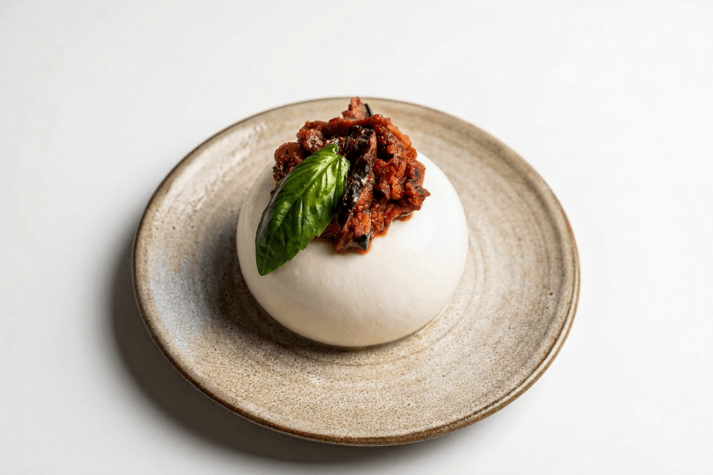 Bufala con parmigiana di melanzane